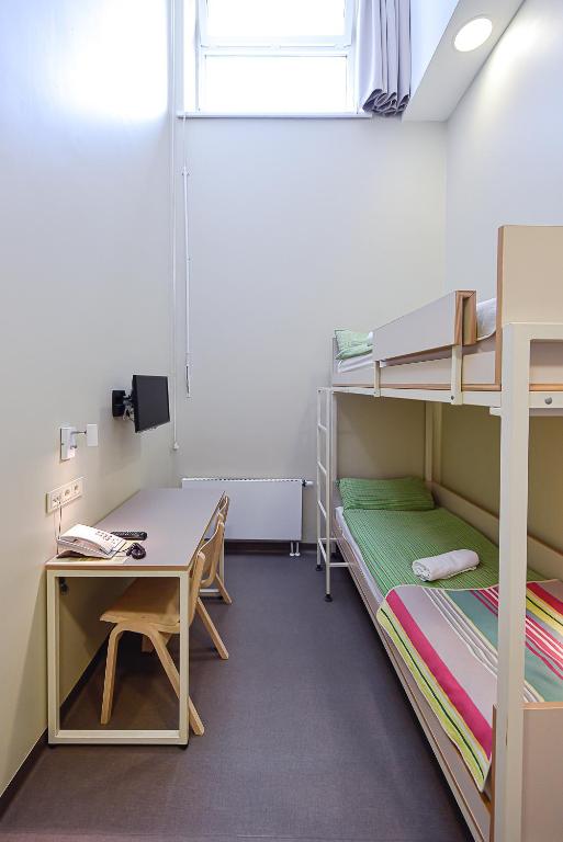 Postel nebo postele na pokoji v ubytování Nykščio Hostel