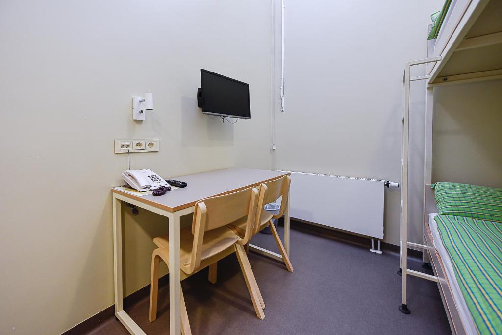 TV a/nebo společenská místnost v ubytování Nykščio Hostel