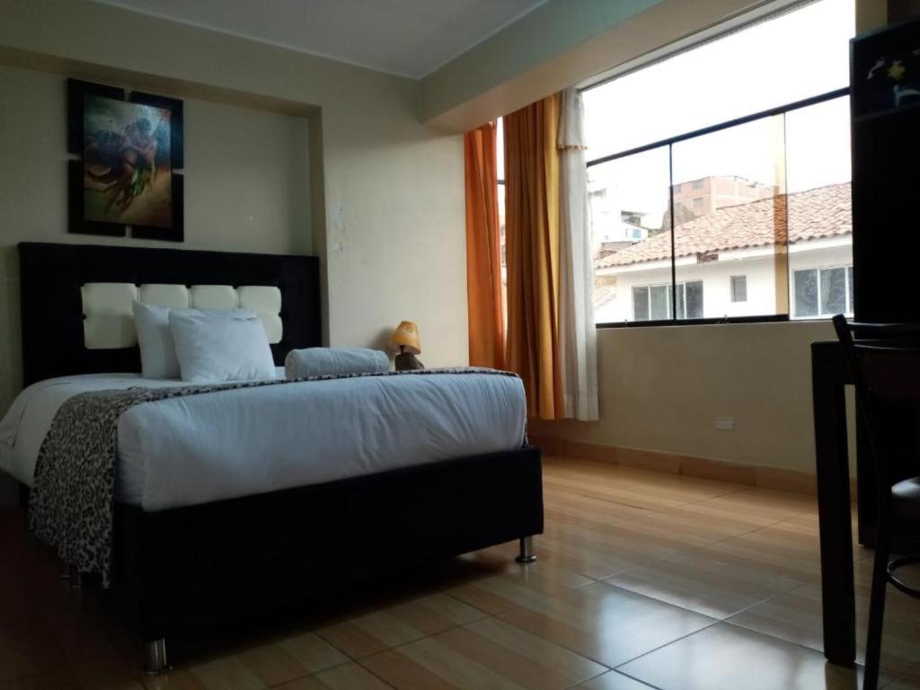Postel nebo postele na pokoji v ubytování Hotel Mantas Cusco