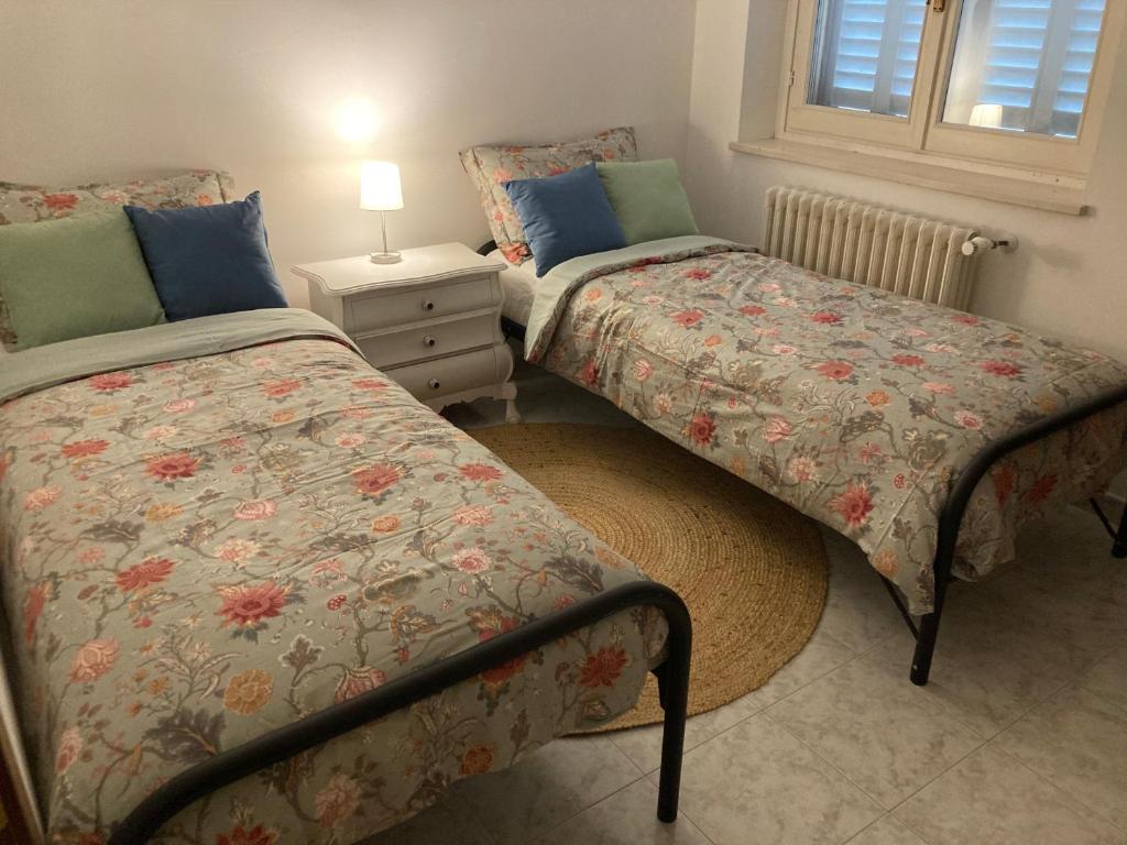 Postel nebo postele na pokoji v ubytování Casa Finestre Bianche