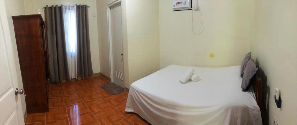 Postel nebo postele na pokoji v ubytování Fontelo Guest House Siquijor