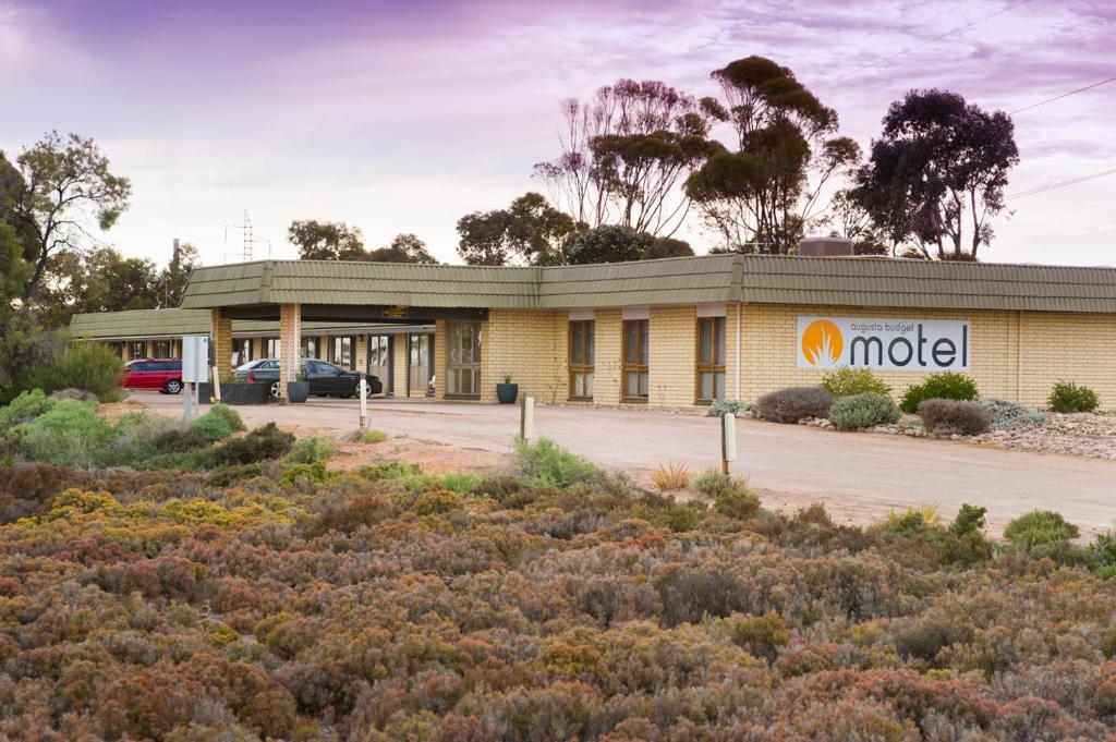 a mobil gas station in front of a building at Augusta Budget Motel in Port Augusta
