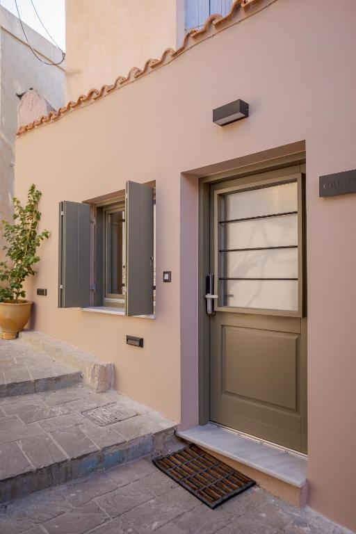 a door on the side of a building at Comfinest in Chania