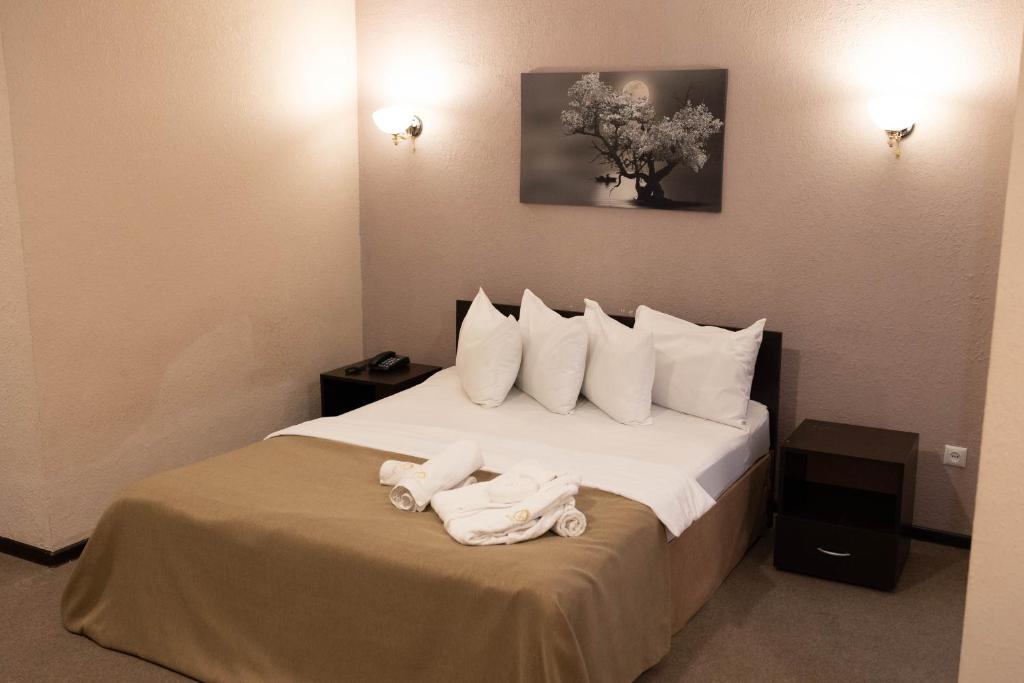 Postel nebo postele na pokoji v ubytování Richmind Hotel