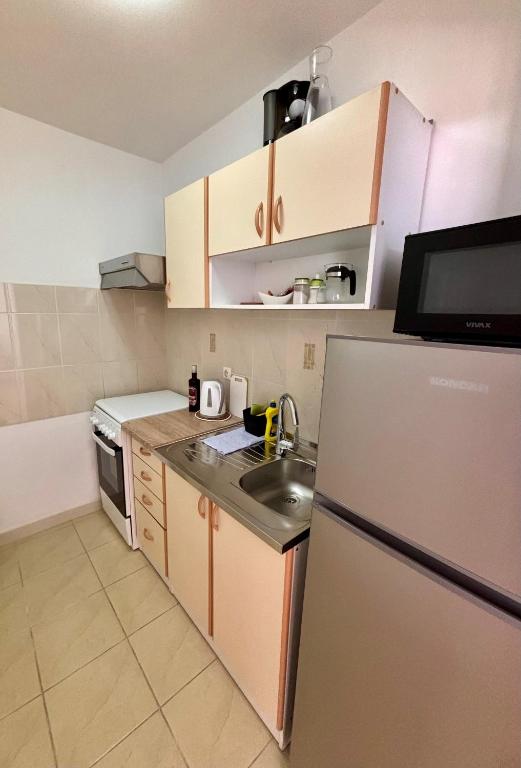 Kuchyňa alebo kuchynka v ubytovaní Apartmani Knežević