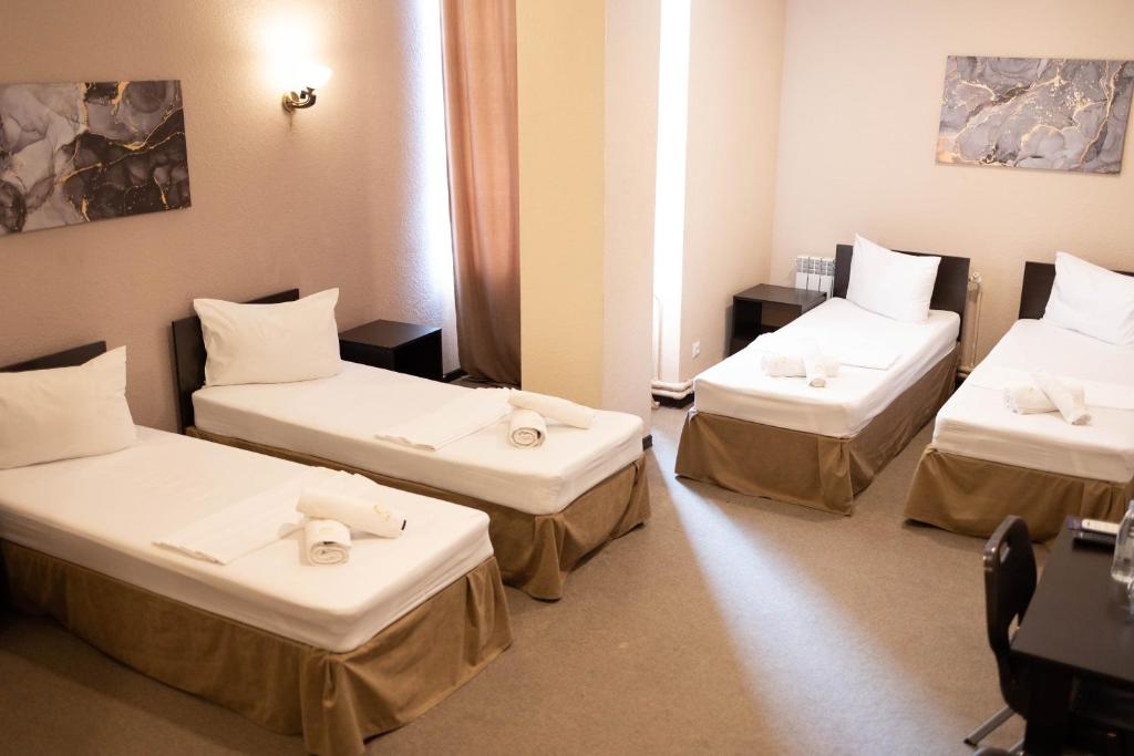 Postel nebo postele na pokoji v ubytování Richmind Hotel
