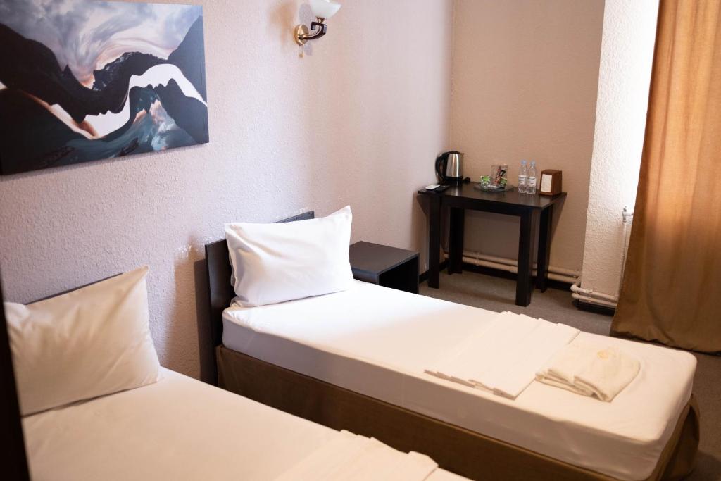 Postel nebo postele na pokoji v ubytování Richmind Hotel
