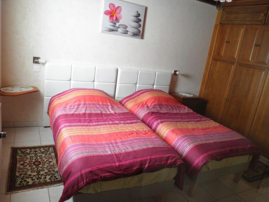 Postel nebo postele na pokoji v ubytování Gîte ''Les Bleuets''