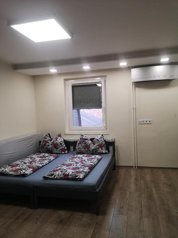 Posteľ alebo postele v izbe v ubytovaní Tp Apartman