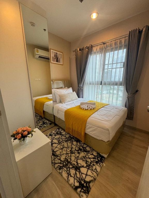 Voodi või voodid majutusasutuse Minimal 2 BR next to IKEA, Central Westgate Bangyai toas