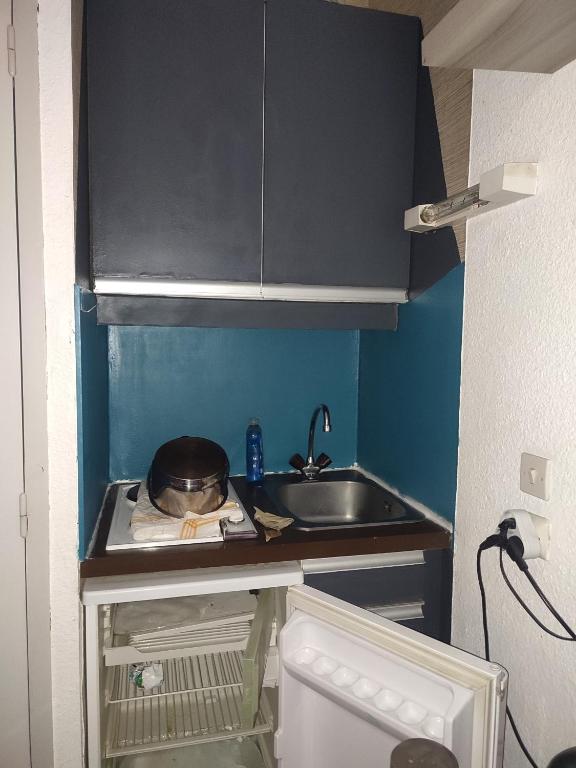 Kuchyň nebo kuchyňský kout v ubytování Le Cow'sy 1800