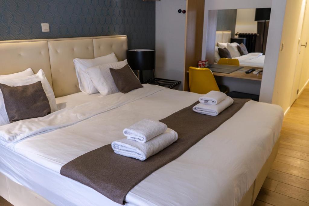Postel nebo postele na pokoji v ubytování Hotel Retro