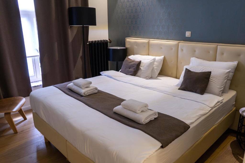Postel nebo postele na pokoji v ubytování Hotel Retro