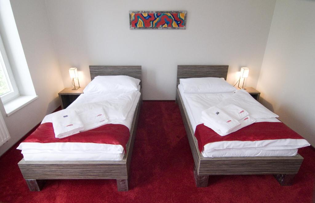 Postel nebo postele na pokoji v ubytování Hotel Olympia