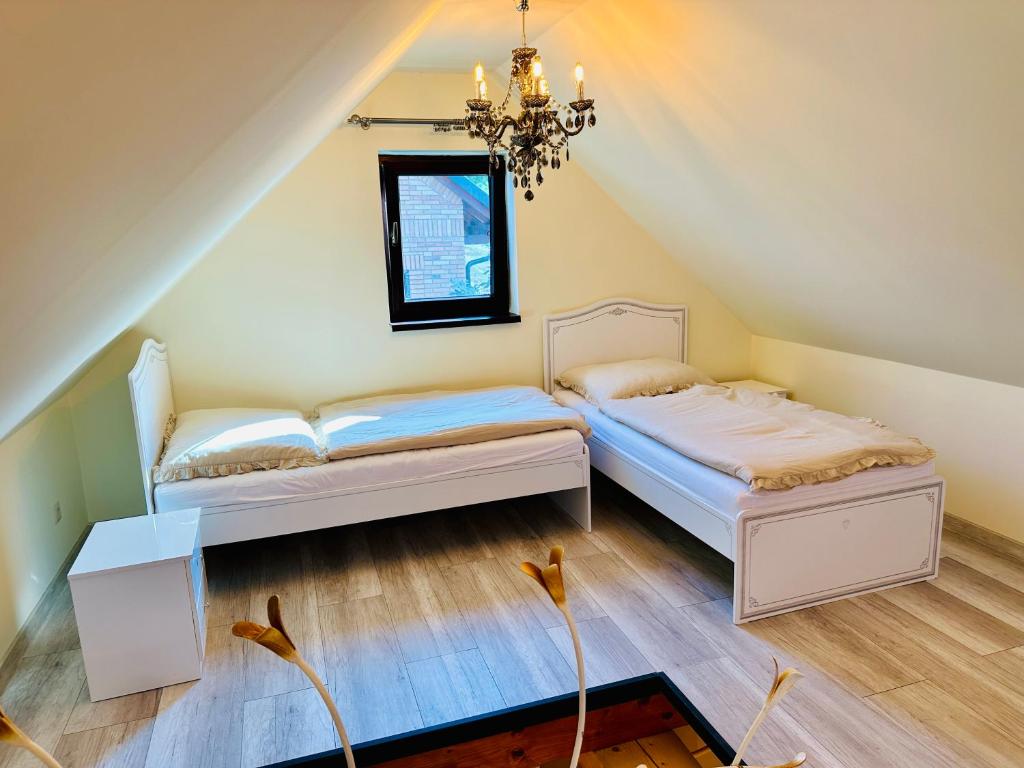 Postel nebo postele na pokoji v ubytování VITALITY Resort Podhájska