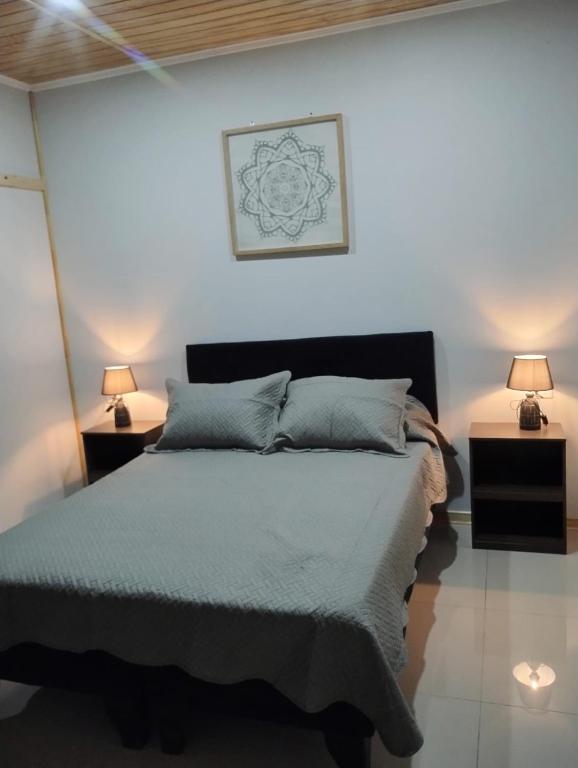Postel nebo postele na pokoji v ubytování Glamping Domos Lago Rapel
