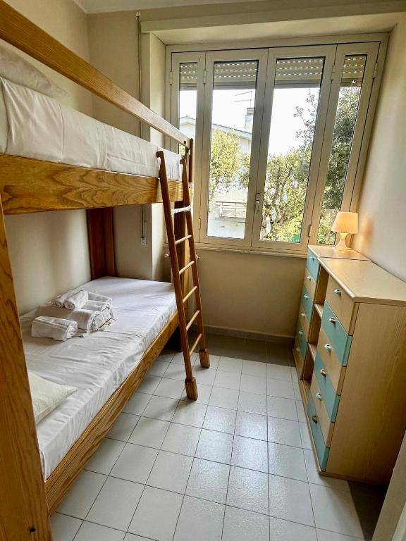 Postel nebo postele na pokoji v ubytování Villetta in centro