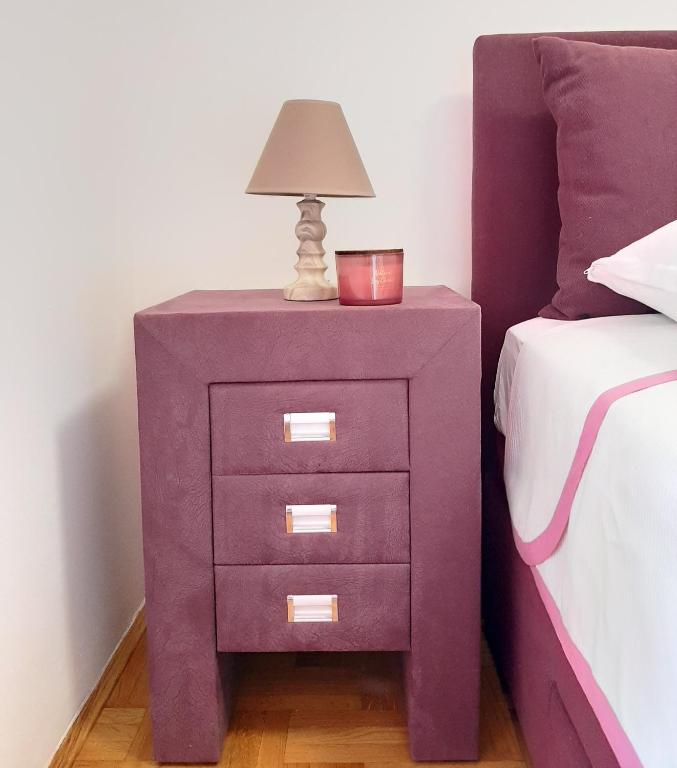 Llit o llits en una habitació de Luča apartman