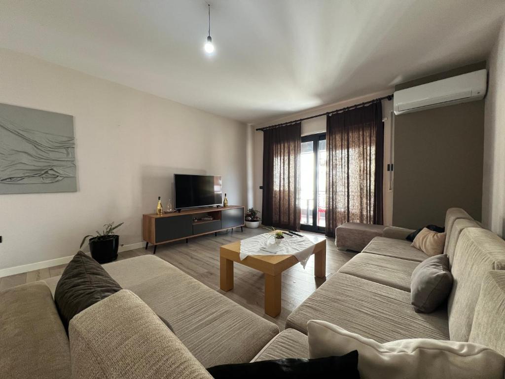 a living room with a couch and a table at B2 Apartment in Tirana