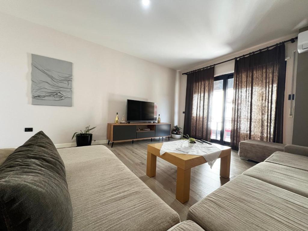 a living room with a couch and a coffee table at B2 Apartment in Tirana