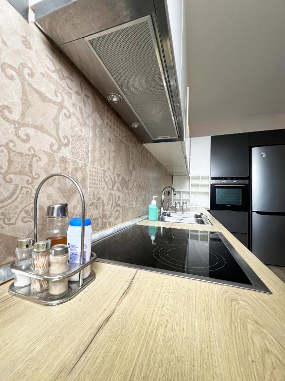 a kitchen with a sink and a counter top at B2 Apartment in Tirana