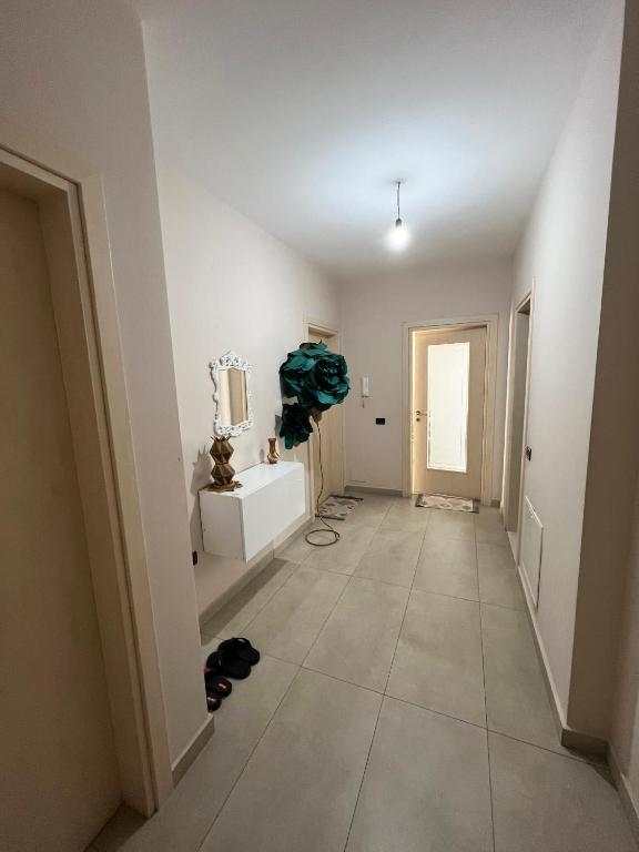 a room with a hallway with a white wall at B2 Apartment in Tirana