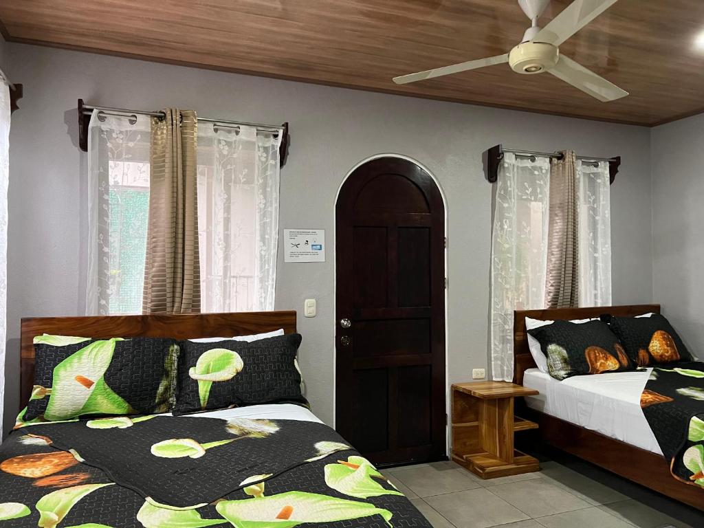 Postel nebo postele na pokoji v ubytování Apartamentos Mansión Tropical