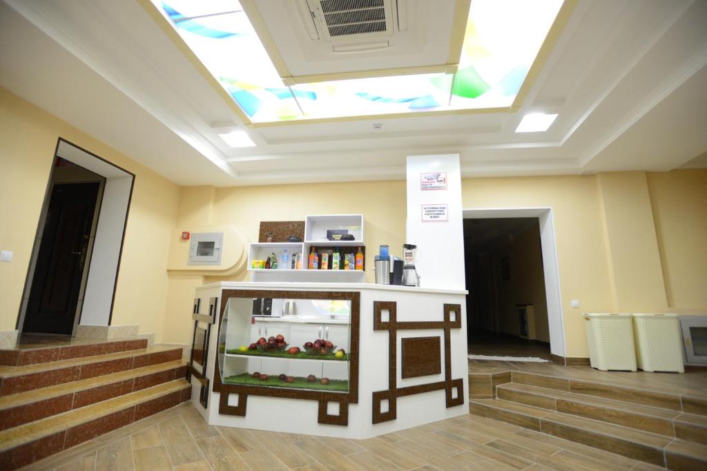 a display in a room with stairs and a skylight at City Line Boutique Hotel in Tashkent