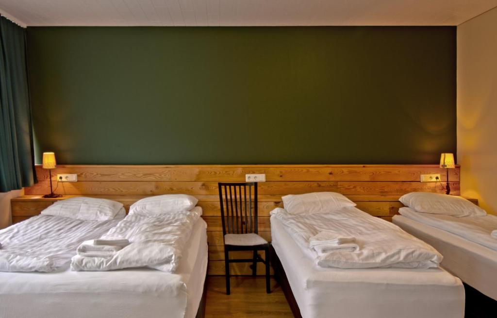 Voodi või voodid majutusasutuse Hotel Post toas