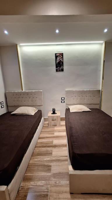 Postel nebo postele na pokoji v ubytování Grand Duplex