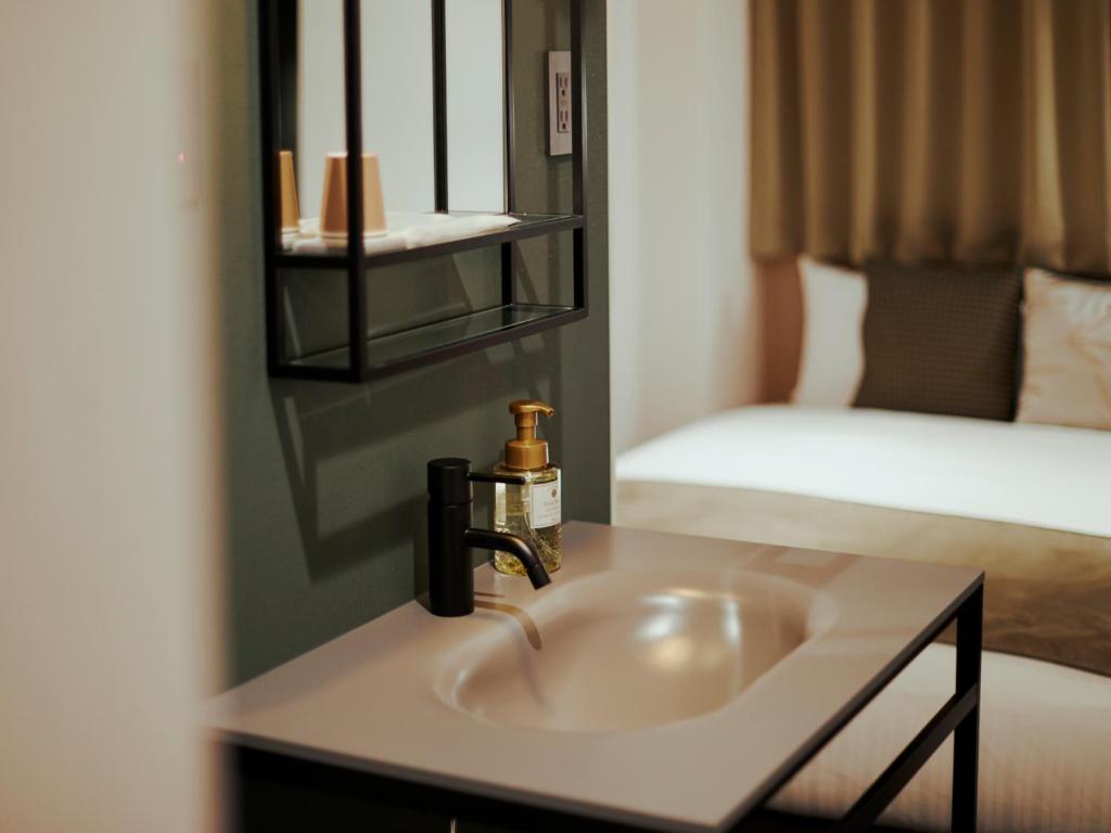 R Hotel Namba Daikokuchoにあるベッド