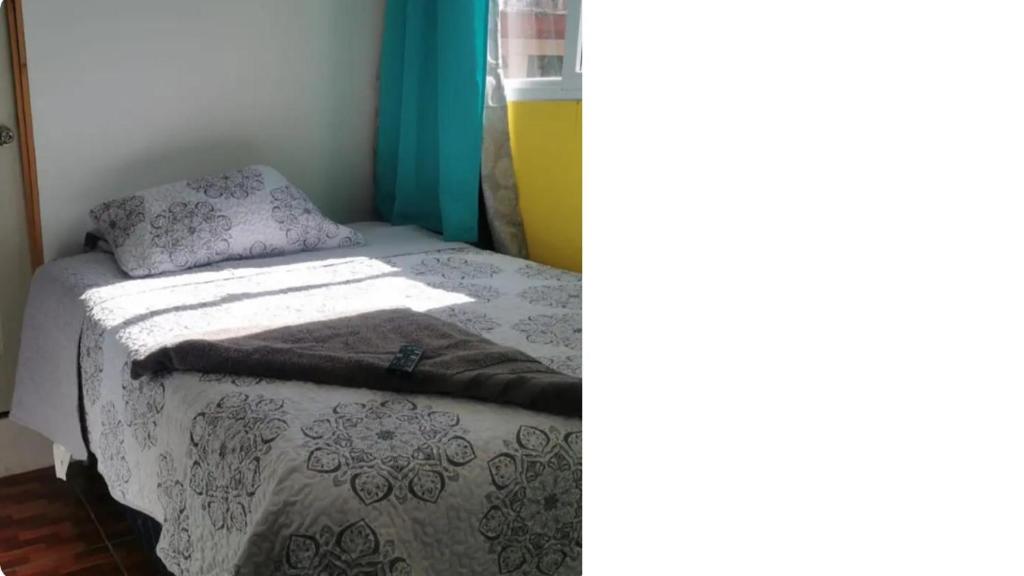 Postel nebo postele na pokoji v ubytování Apartamentos La Divina Misericordia