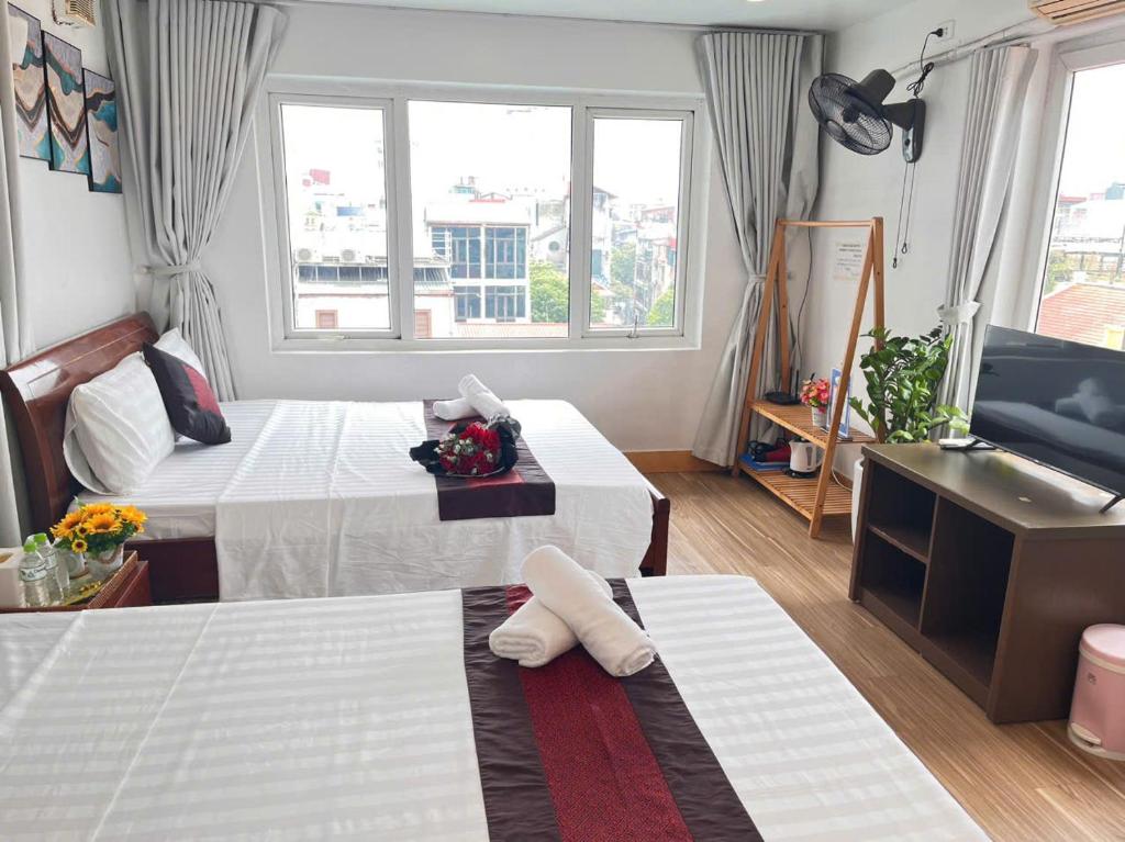 Postel nebo postele na pokoji v ubytování Fortuna Homestay