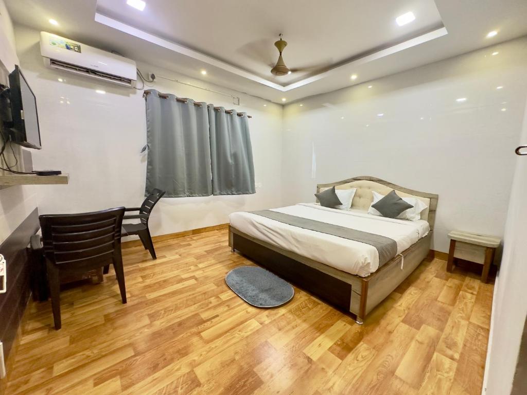 Postel nebo postele na pokoji v ubytování Hi5 Hotel Aryan