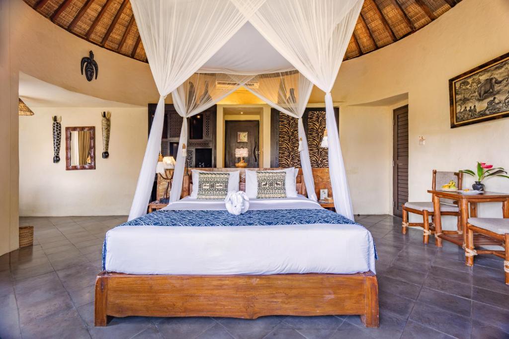 Postel nebo postele na pokoji v ubytování Mara River Safari Lodge Bali