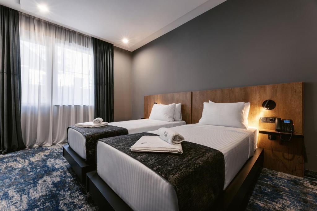 Postel nebo postele na pokoji v ubytování Hotel Splendid Tbilisi