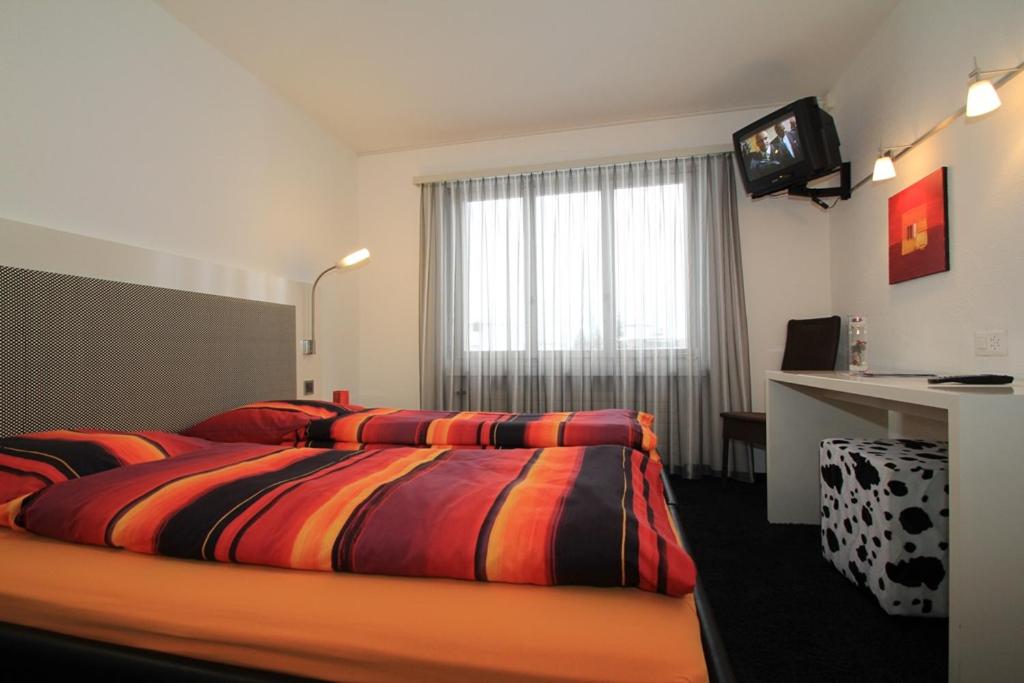 Postel nebo postele na pokoji v ubytování Hotel Franz Anton