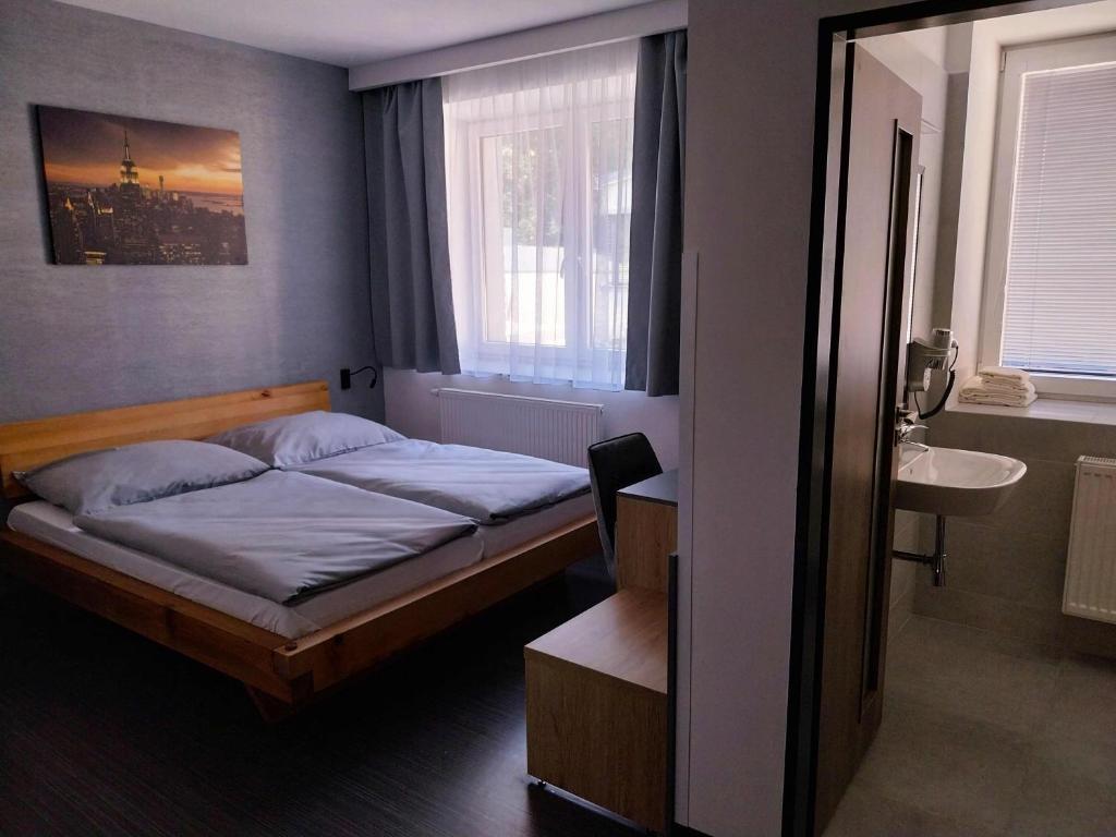 Postel nebo postele na pokoji v ubytování Hotel Fabrica