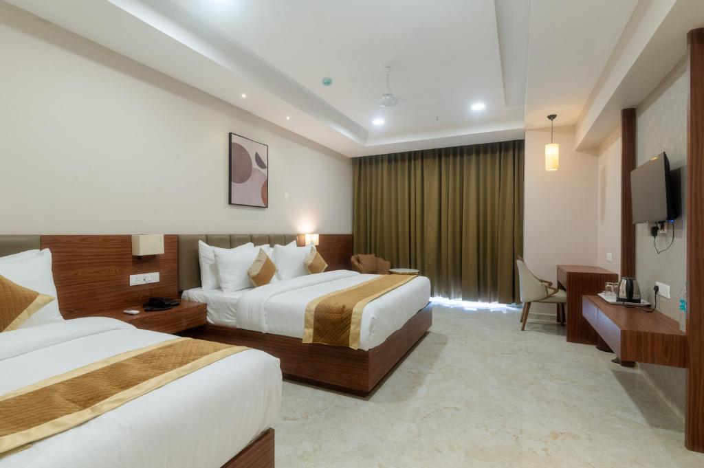 Giường trong phòng chung tại VITS Satyajeet Karad