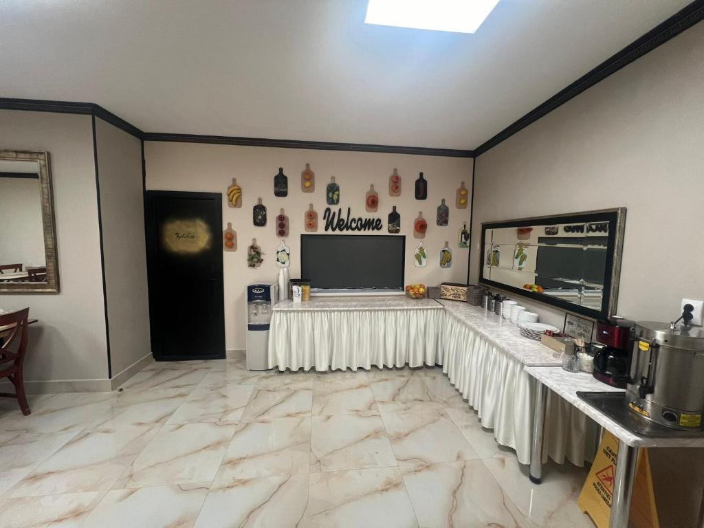 Kuchyň nebo kuchyňský kout v ubytování Hotel Reina