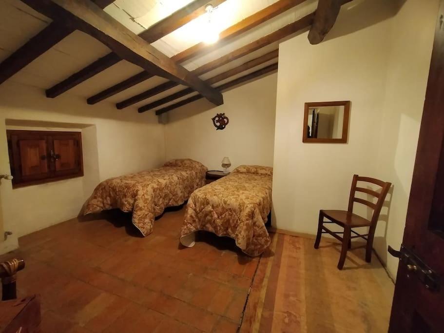 Łóżko lub łóżka w pokoju w obiekcie Casa Botena