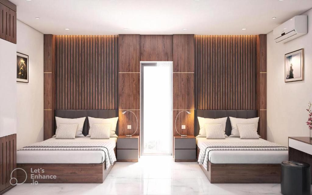 Postel nebo postele na pokoji v ubytování Anh Nguyet Da Nang Hotel