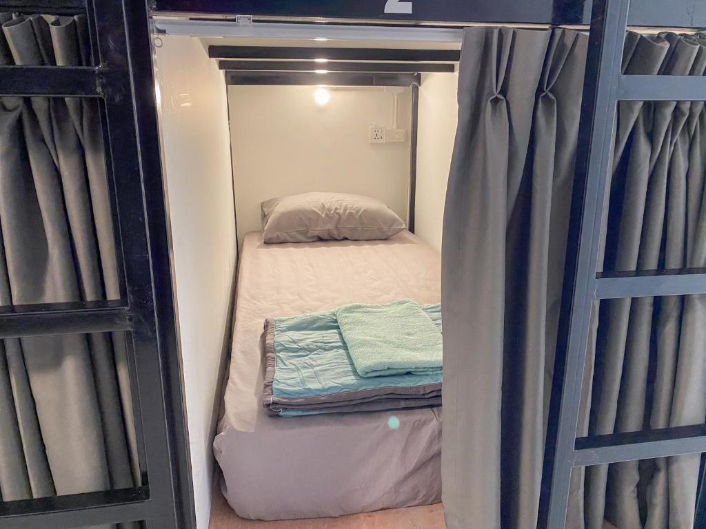 Postel nebo postele na pokoji v ubytování Misfits Hostel Pai