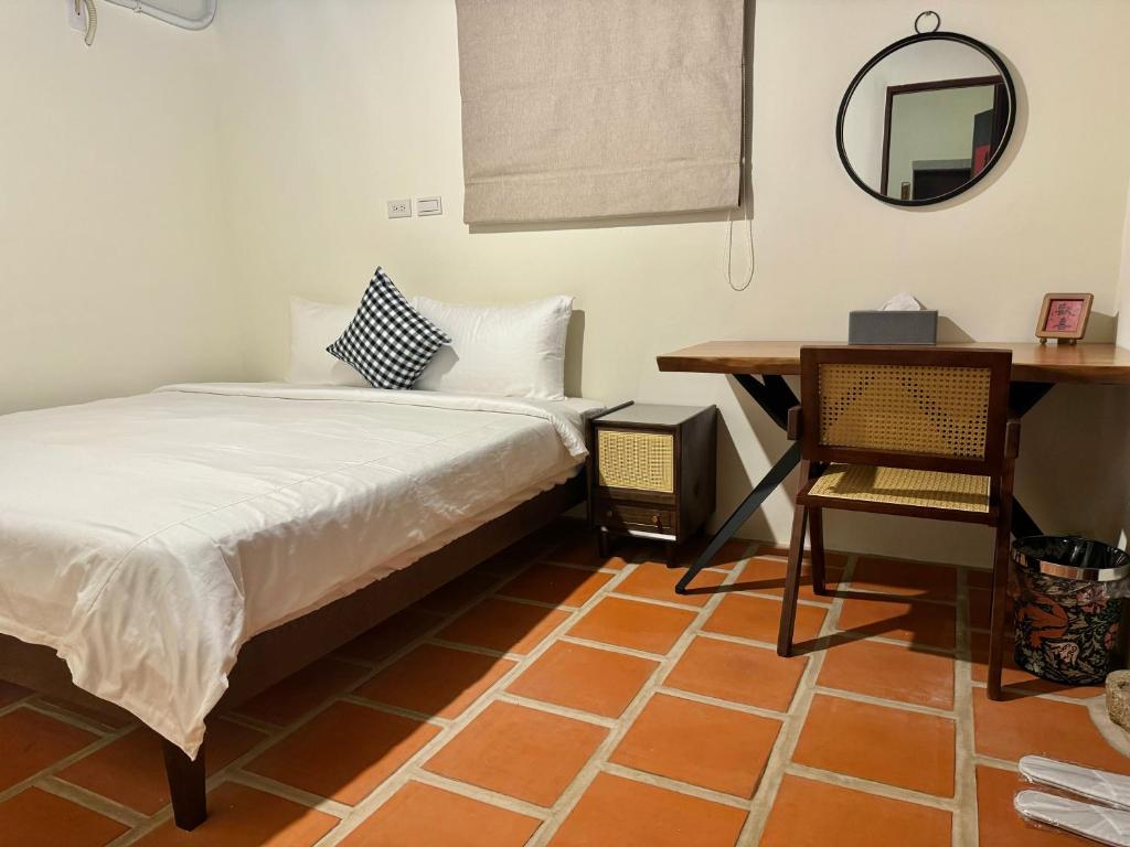 Postel nebo postele na pokoji v ubytování Minnan Homestay