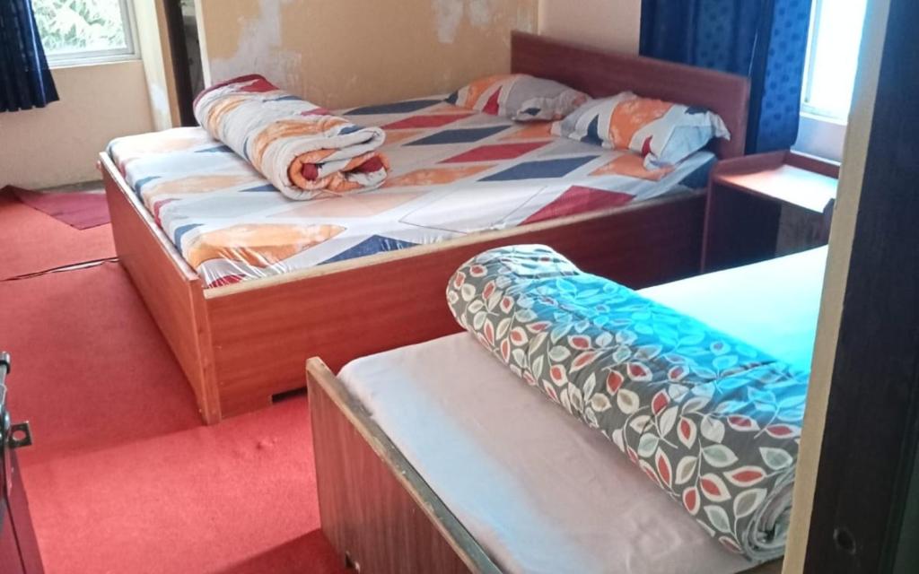 Postel nebo postele na pokoji v ubytování Green Wings Homestays by StayApart , Zoom , West Sikkim