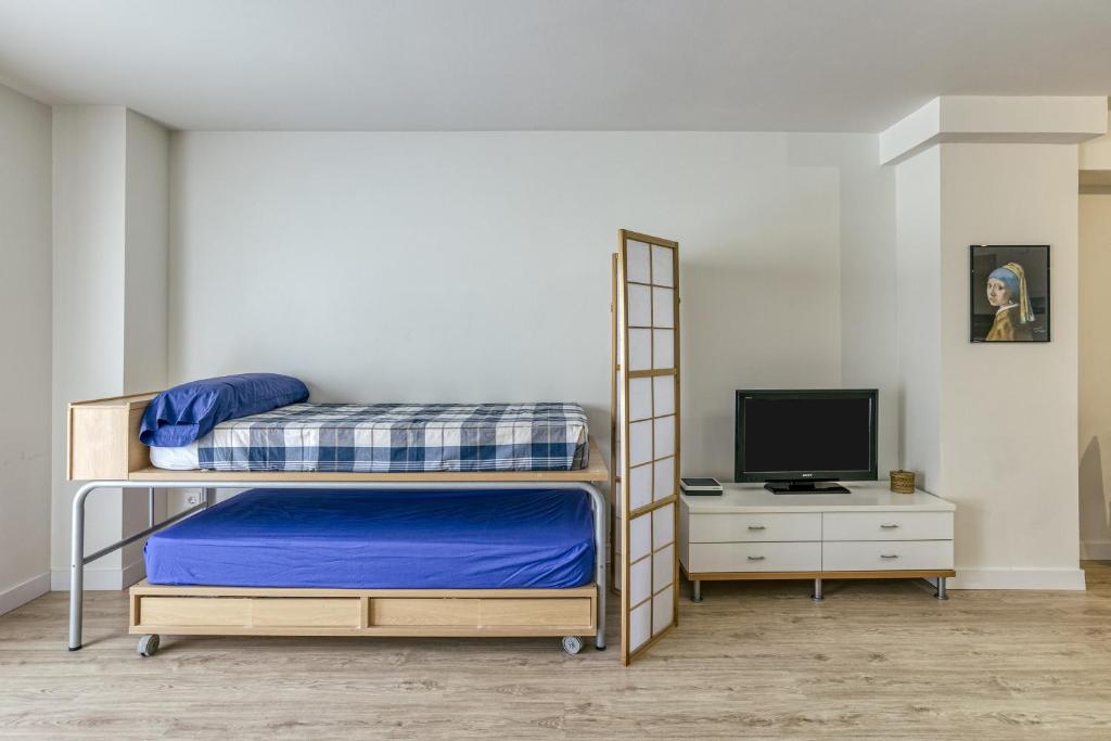 Postel nebo postele na pokoji v ubytování Loft Palamós