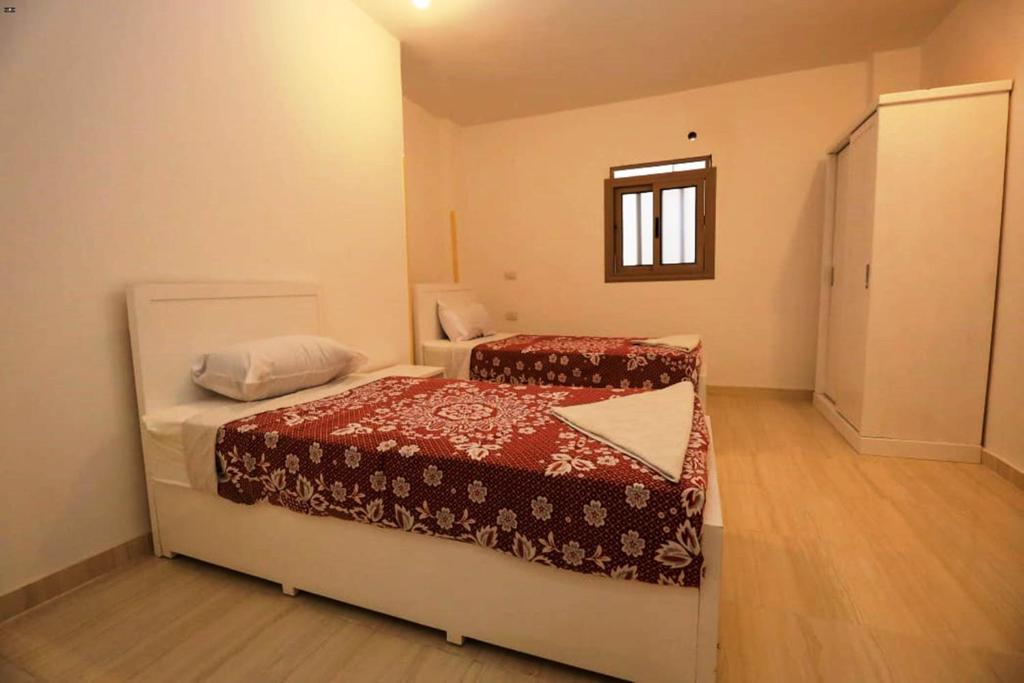 Postel nebo postele na pokoji v ubytování Luxor View Hostel