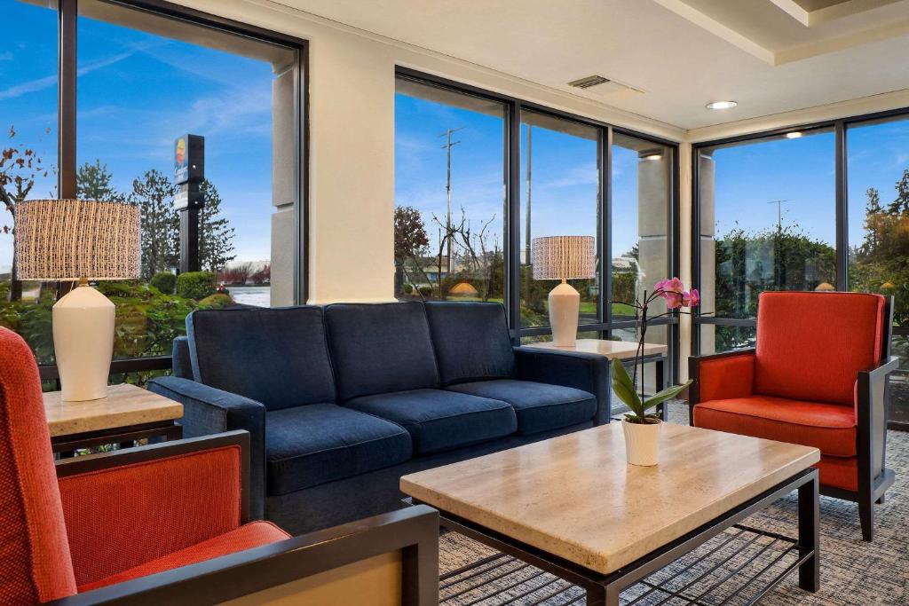 a living room with a couch and chairs at Comfort Inn Bellingham in Bellingham