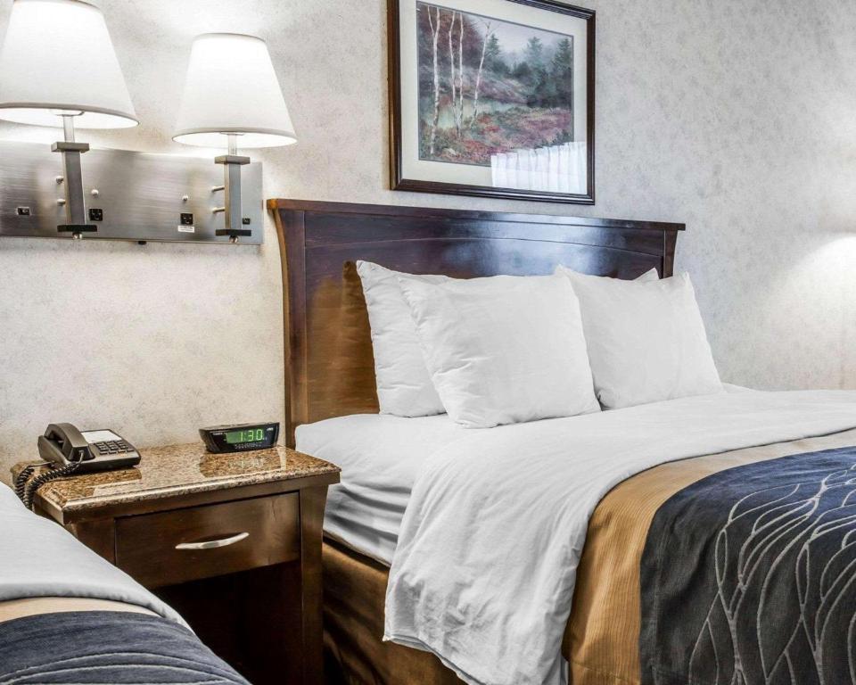 a hotel room with two beds and a telephone at Comfort Inn Bellingham in Bellingham