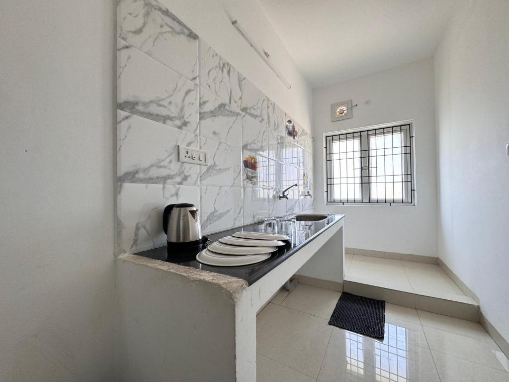 Kuchyň nebo kuchyňský kout v ubytování Royal Beach Service Apartment